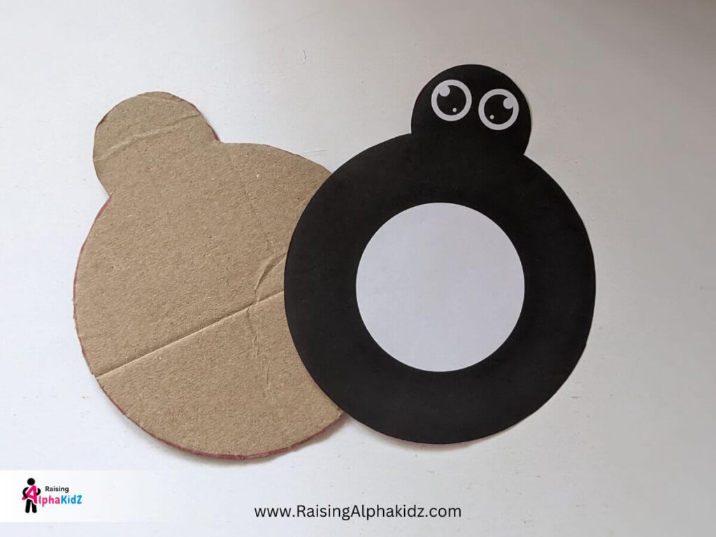 Cut the cardboard in shape of spider in the printable