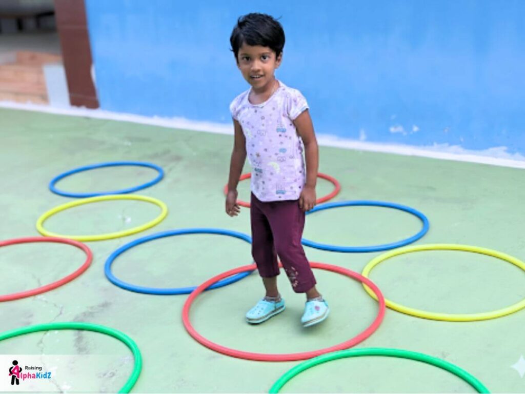 Kid playing jumping game with hula loop