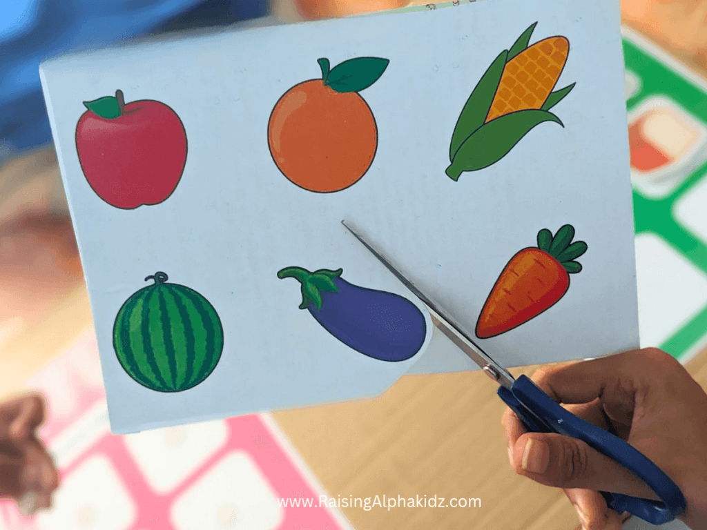 Cutting grocery items from the pretend play free printable