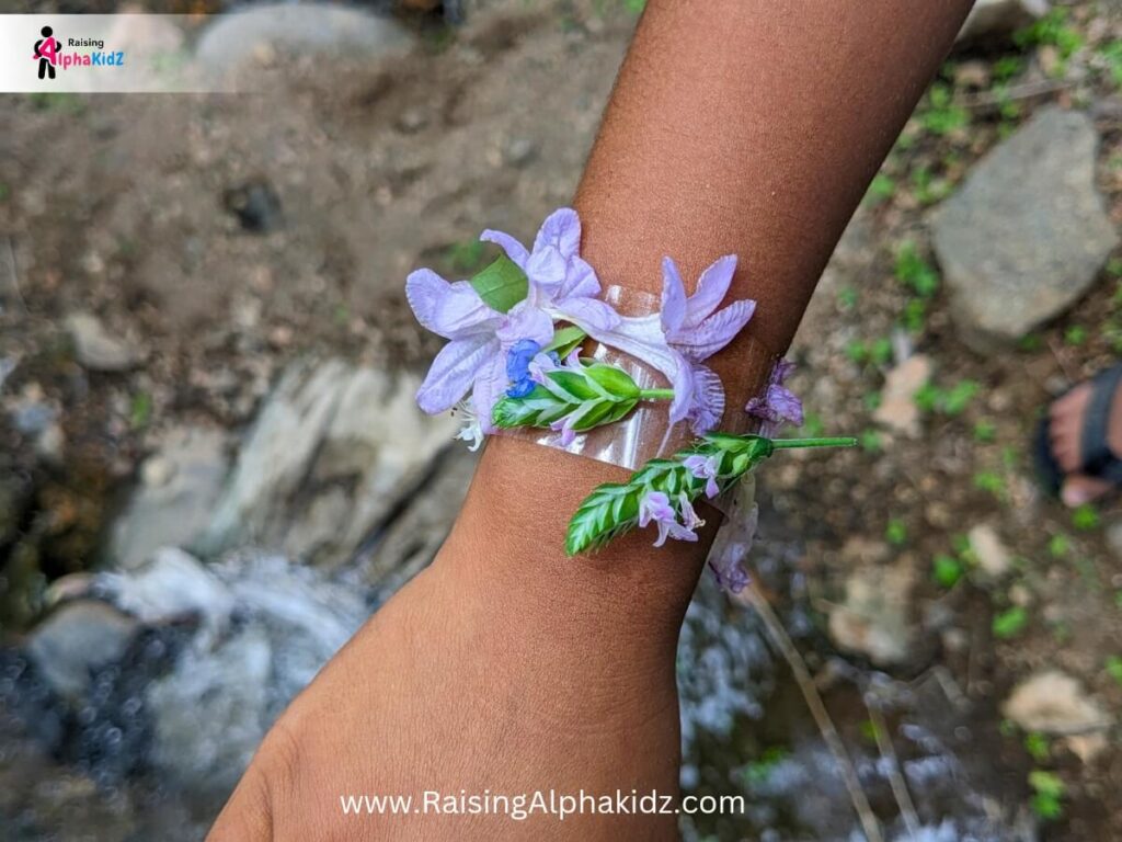 Close-up of a homemade flower bracelet on a child’s wrist
