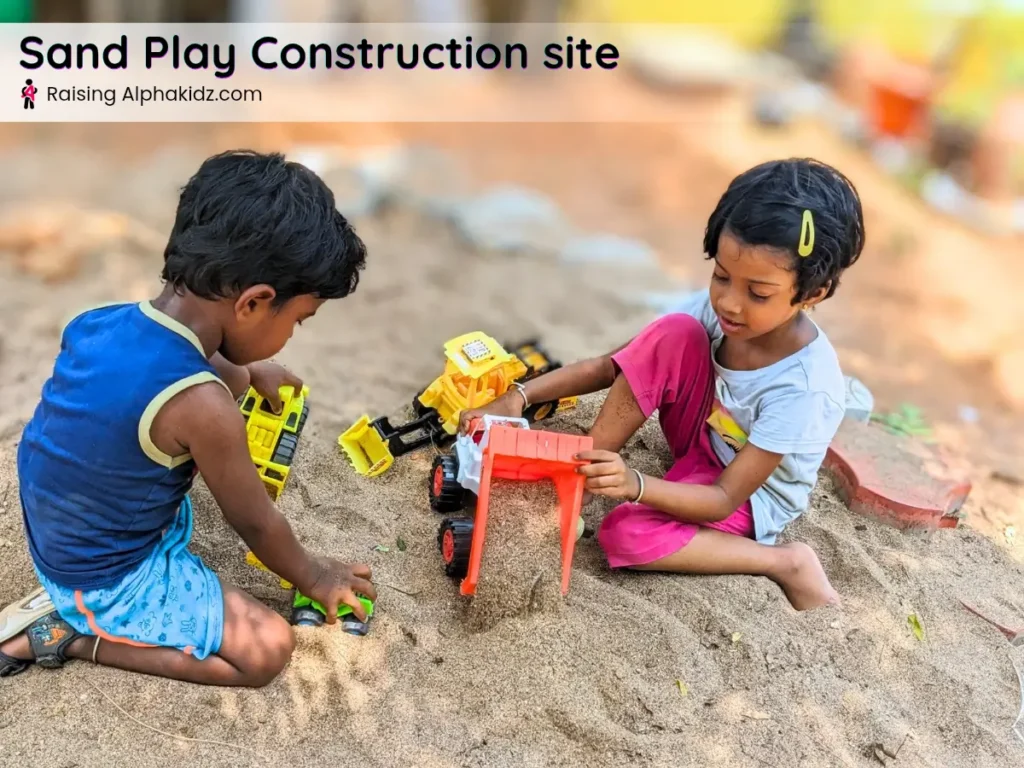 kids playing with diggers and trucks on sand play construction site