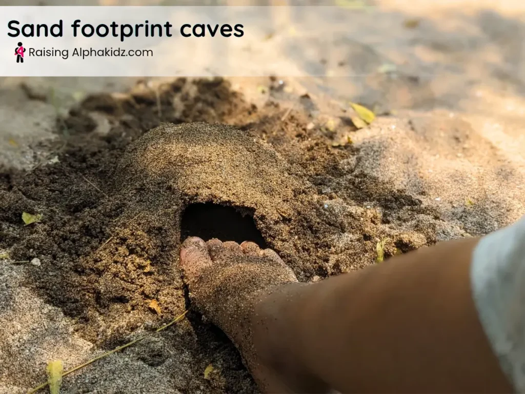 kid using feet to make caves on moist sand