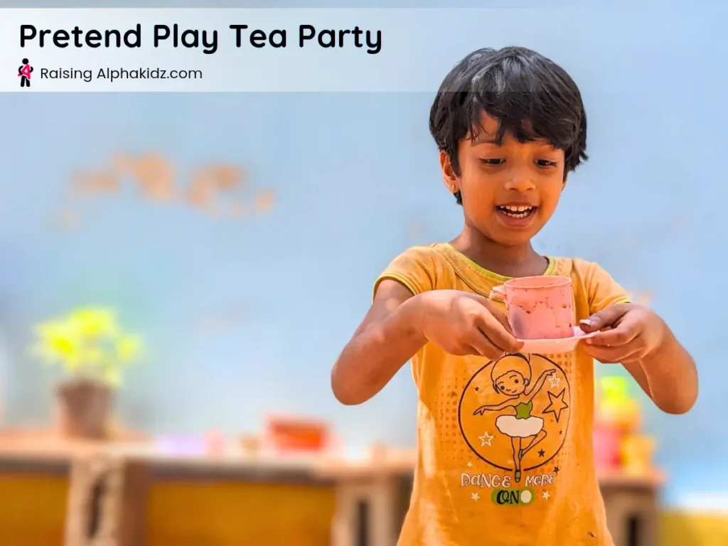 child making pretend tea with sand and water in sand play