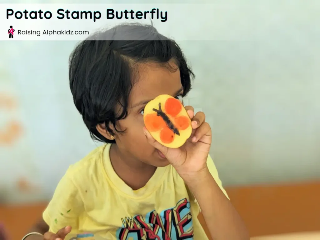 butterfly potato stamp fully dipped in colorful paint