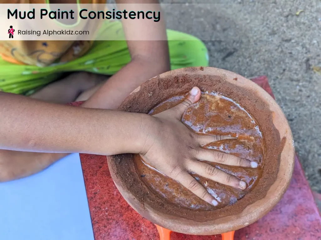 hands soaked in mud paint showing thick consistency