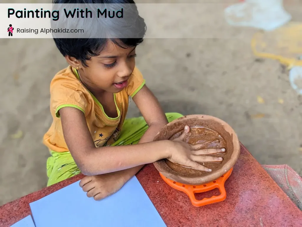 hands soaked in mud paint showing thick consistency
