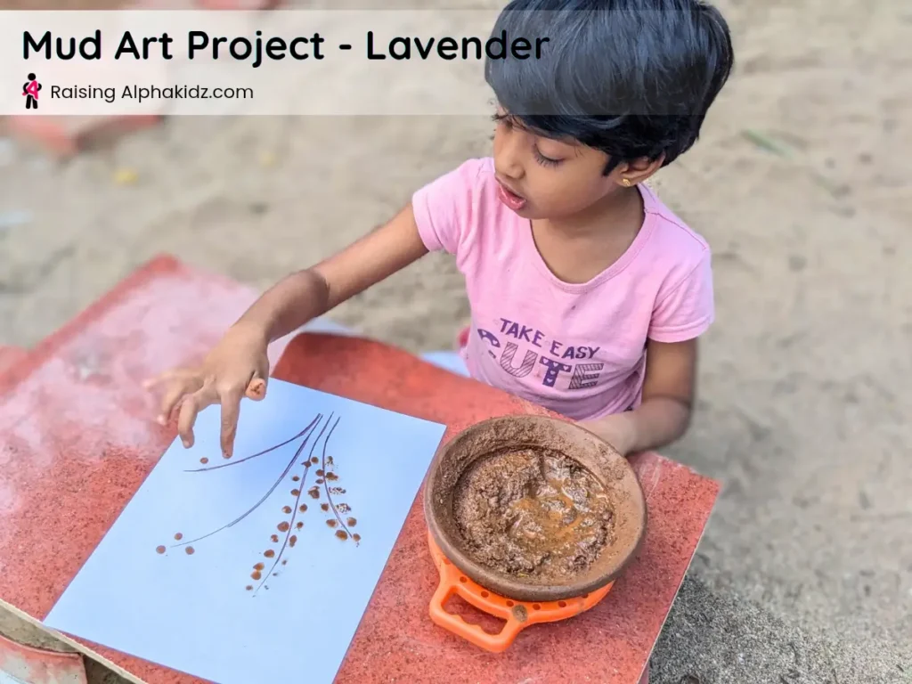 kid making lavender mud painting