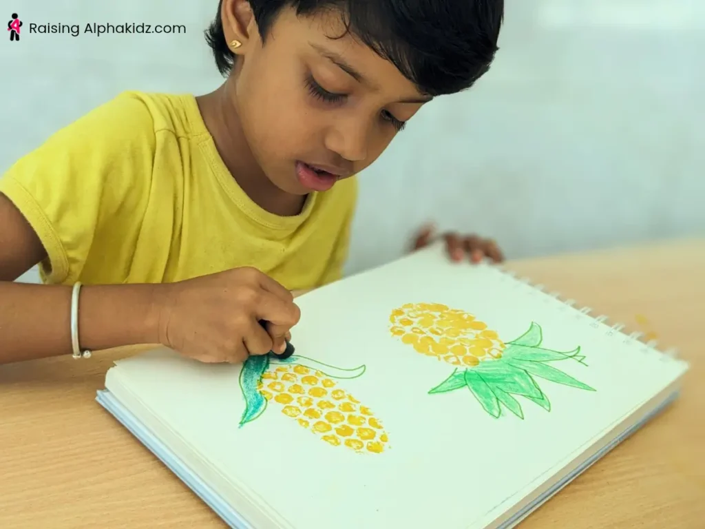 A kid making corn prints using bubble wrap stamp