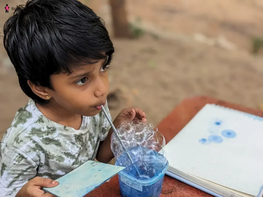 Teaching kids to blow the soap mixture