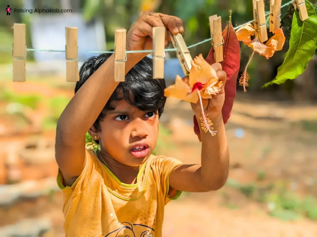Kid fixing the hibiscus flower in a nature garland string